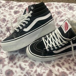Vans Women's Black and White High-Top Sneakers